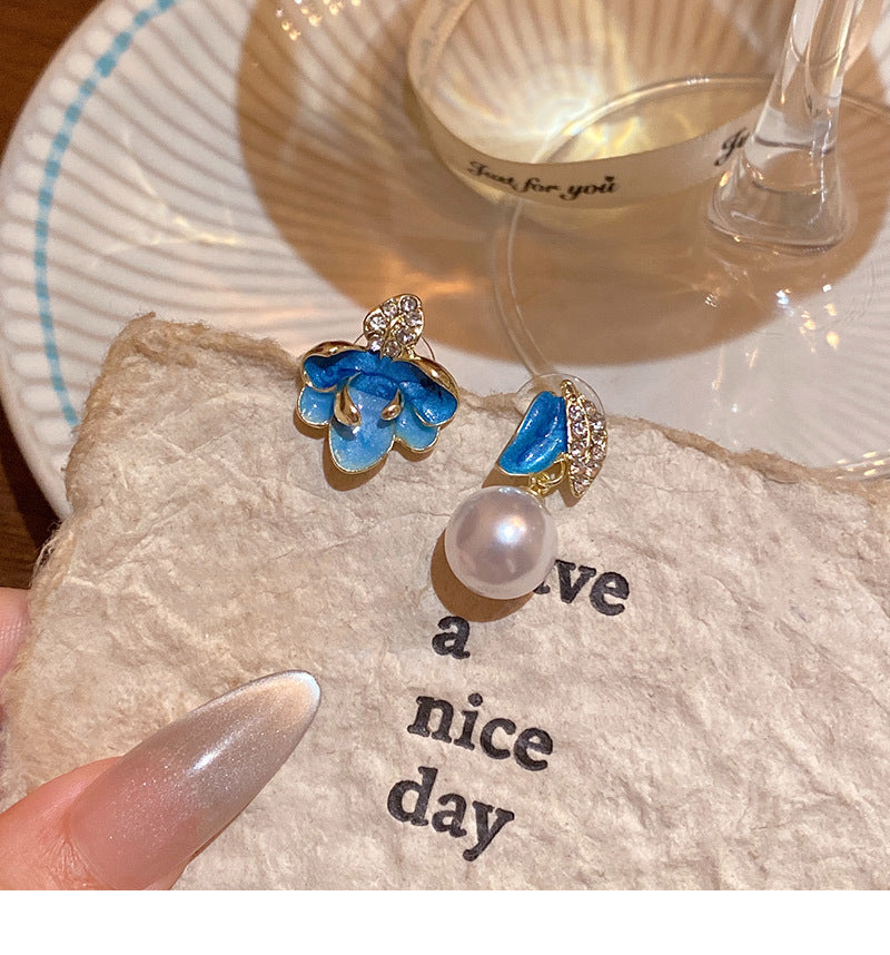 Asymmetrical drop-shaped flower earrings in enamel, set with diamonds and pearls